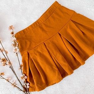 Pleated Orange Skirt